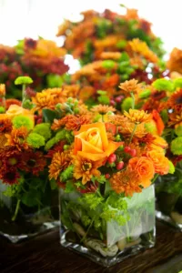 green and orange flowers - wedding table centerpiece