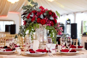 red flower decoration in clear vase - wedding table decoration