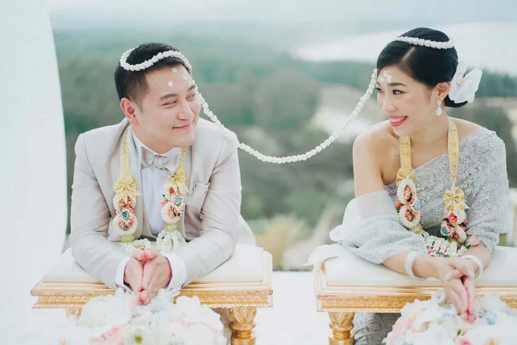 thai couple during sai monkhon ceremony