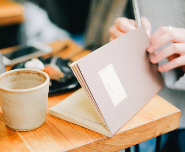 Wedding Budget - Writing In Notebook