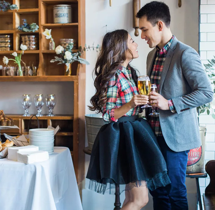 Engagement Party Planning - Couple Holding Champagne Glasses