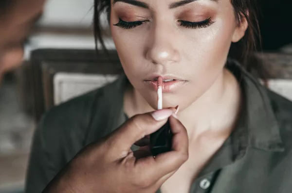 Wedding Makeup Artist Applying Lipstick