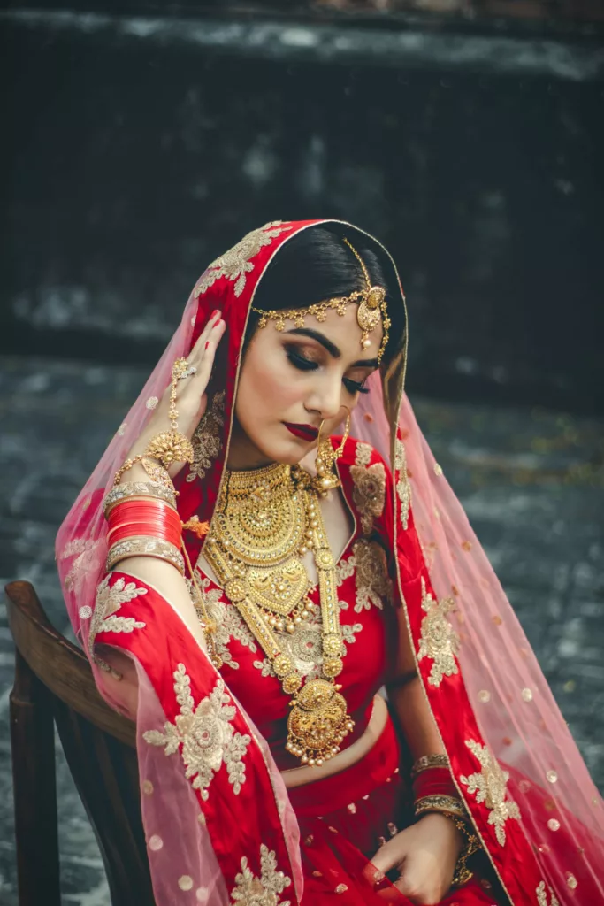 Indian bride wearing red saree.