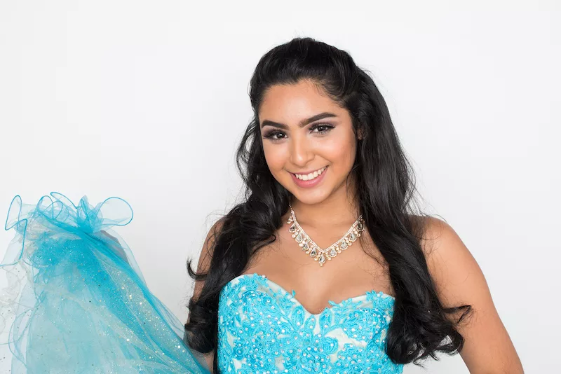 Young women in baby blue quinceanera dress.