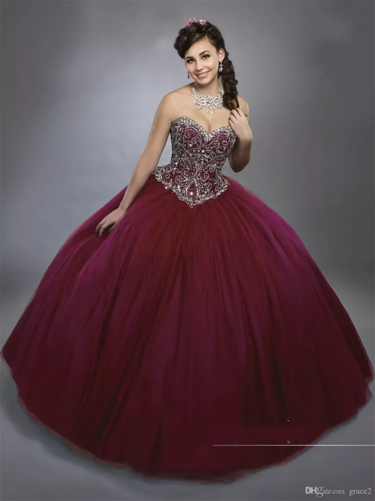 Young women in burgundy quinceanera dress.